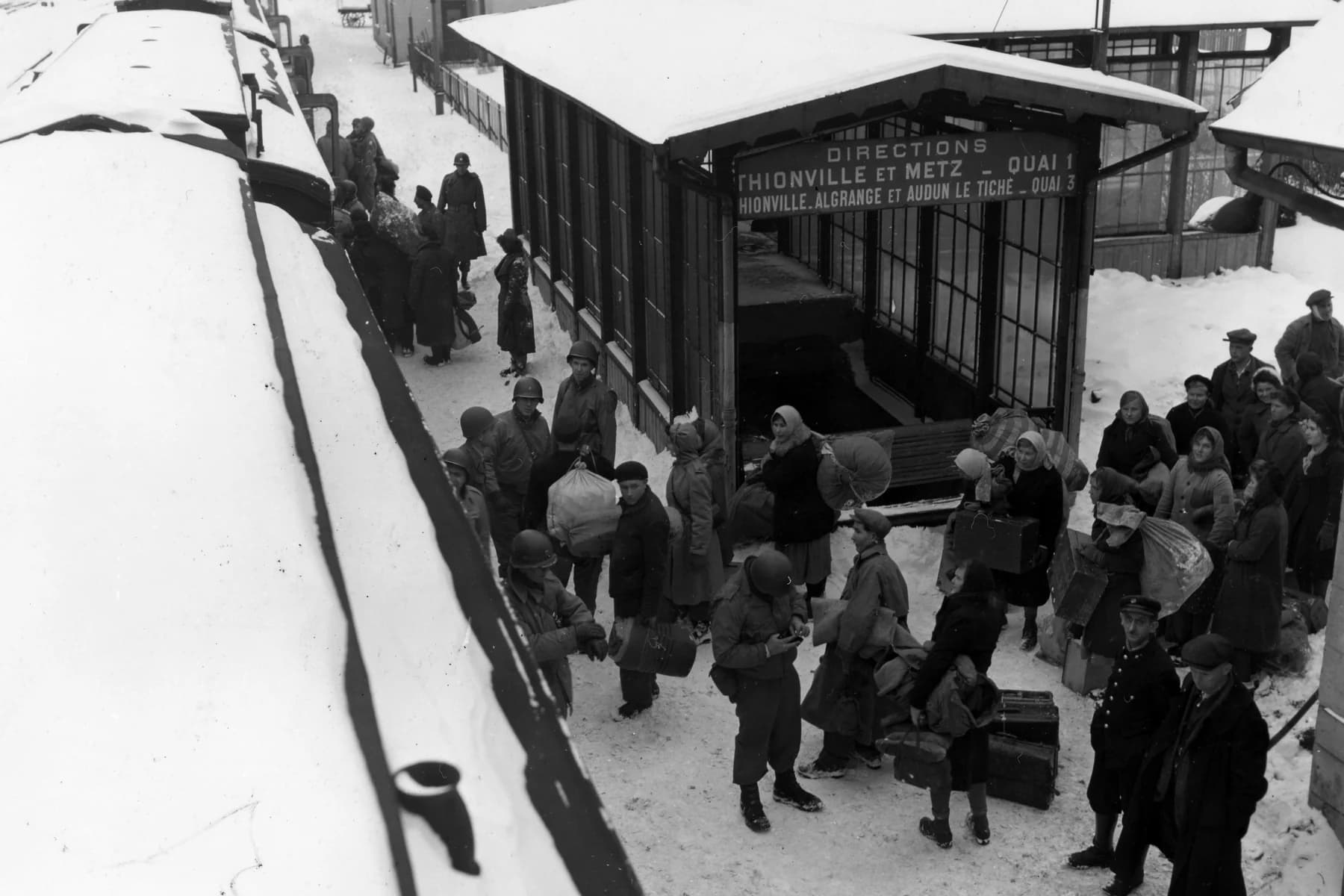 Displaced Russian civilians boarding a train at Hayange, France, in January 1945